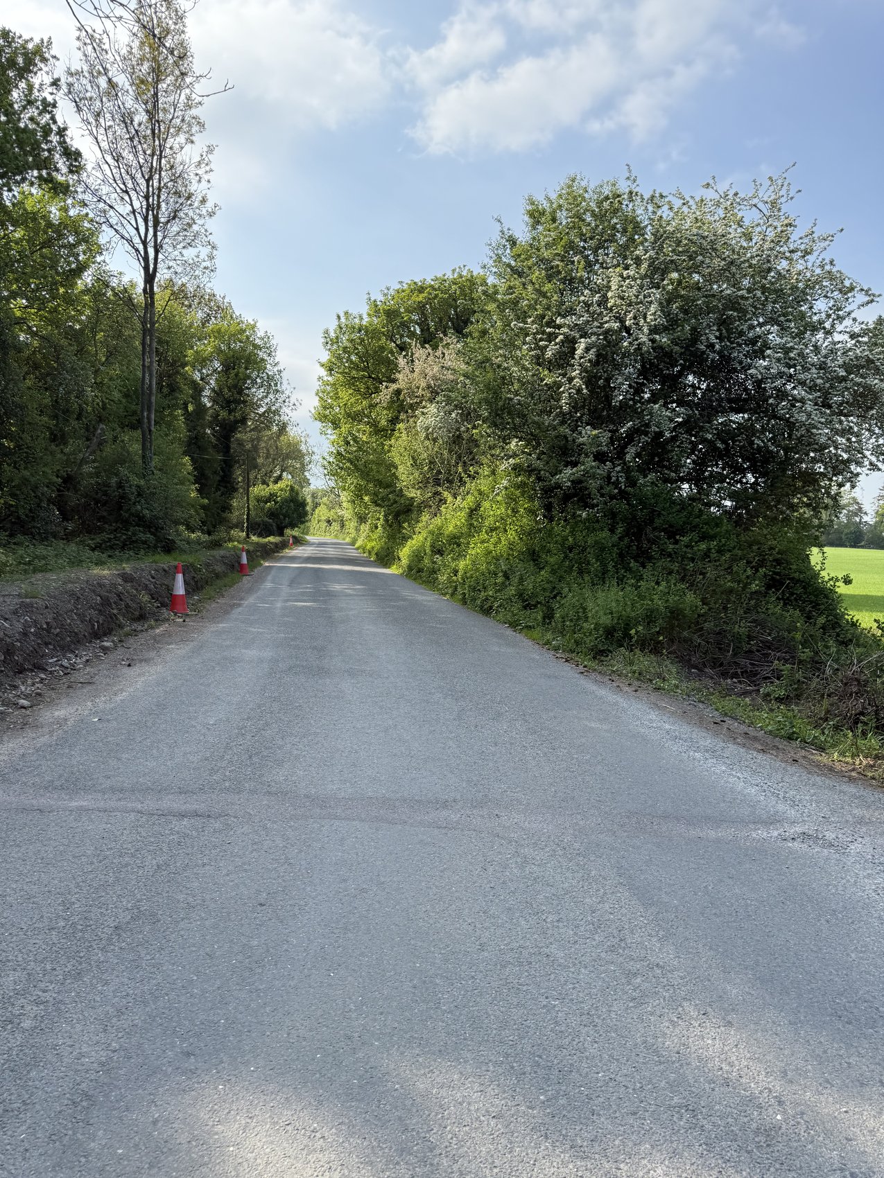The wider road approach beside the bank